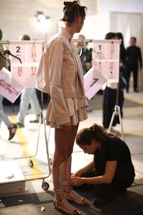 (160923) -- MILAN, Sept. 23, 2016 -- A model has her shoes changed backstage of Diesel Black Gold fashion show during Milan Fashion Week Spring Summer 2017 in Milan, Italy, Sept. 23, 2016. )(cl) ITALY-MILAN-FASHION WEEK-DIESEL BLACK GOLD-BACKSTAGE JinxYu 