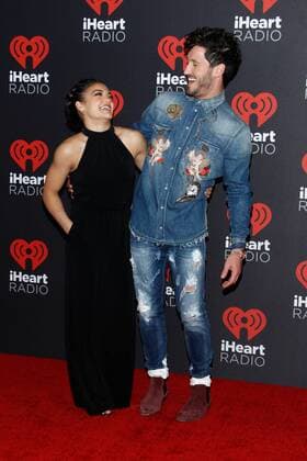 Olympic gymnast Laurie Hernandez and Val Chmerkovskiy arrive for the iHeartRadio Music Festival at the T-Mobile Arena in Las Vegas, Nevada on September 23, 2016.  LVP2016092354 JAMESxATOA