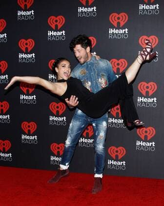 Olympic gymnast Laurie Hernandez and Val Chmerkovskiy arrive for the iHeartRadio Music Festival at the T-Mobile Arena in Las Vegas, Nevada on September 23, 2016.  LVP2016092356 JAMESxATOA
