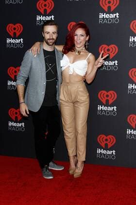 Race car driver James Hinchcliffe and professional dancer Sharna Burgess arrive for the iHeartRadio Music Festival at the T-Mobile Arena in Las Vegas, Nevada on September 23, 2016.  LVP20160923123 JAMESxATOA
