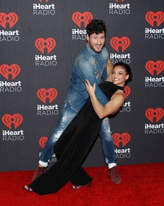 Olympic gymnast Laurie Hernandez and Val Chmerkovskiy arrive for the iHeartRadio Music Festival at the T-Mobile Arena in Las Vegas, Nevada on September 23, 2016.  LVP2016092363 JAMESxATOA