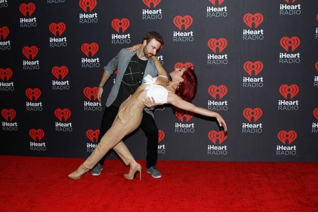Race car driver James Hinchcliffe and professional dancer Sharna Burgess arrive for the iHeartRadio Music Festival at the T-Mobile Arena in Las Vegas, Nevada on September 23, 2016.  LVP20160923124 JAMESxATOA