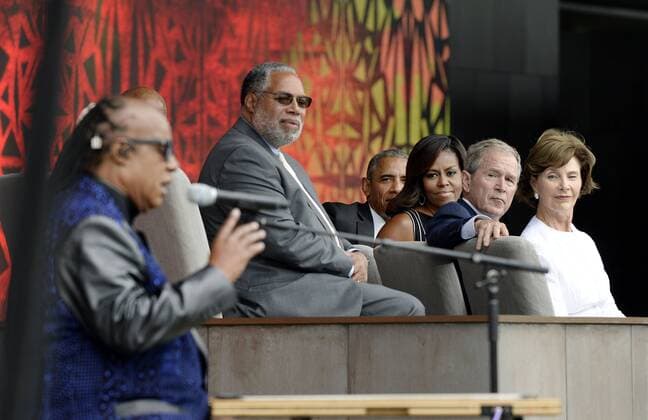 (R to L) : Former First Lady Laura Bush, former President George W. Bush, U.S President Barack Obama and First Lady Michelle Obama listen to singer Stevie Wonder during the opening ceremony of the Smithsonian National Museum of African American History and Culture on September 24, 2016 in Washington, DC. The museum is opening thirteen years after Congress and President George W. Bush authorized its construction. Pool  WAX20160924111 OlivierxDouliery