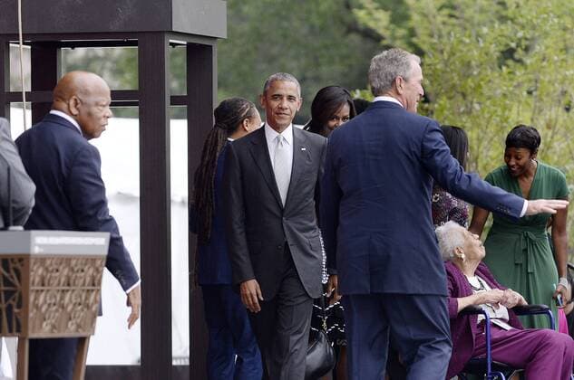 September 24, 2016 - Washington, District of Columbia, United States of America - United States Representative John Lewis Democrat of Georgia), left, U.S President Barack Obama, center, and former President George W. Bush (R) share the stage with the Bonner Family during the opening ceremony of the Smithsonian National Museum of African American History and Culture on September 24, 2016 in Washington, DC. The museum is opening thirteen years after Congress and President George W. Bush authorized its construction. .Credit: Pool via CNP Washington United States of America - ZUMAs152