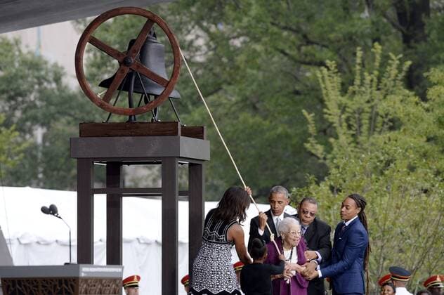 September 24, 2016 - Washington, District of Columbia, United States of America - United States President Barack Obama and First Lady Michelle Obama are join up with the Bonner Family to ring the onstage bell. during the opening ceremony of the Smithsonian National Museum of African American History and Culture on September 24, 2016 in Washington, DC. The museum is opening thirteen years after Congress and President George W. Bush authorized its construction. .Credit: Pool via CNP Washington United States of America - ZUMAs152