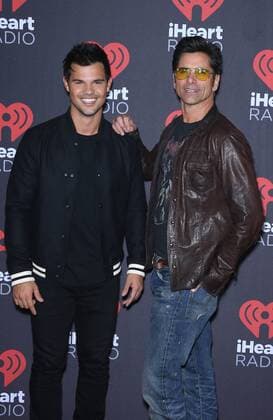 September 24, 2016 - Las Vegas, NV, United States - 24 September 2016 - Las Vegas, NV - Taylor Lautner, John Stamos. 2016 iHeart Radio Music Festival Photo Room at T-Mobile Arena, Day 2. Photo Credit: MJT AdMedia Las Vegas United States - ZUMAa123