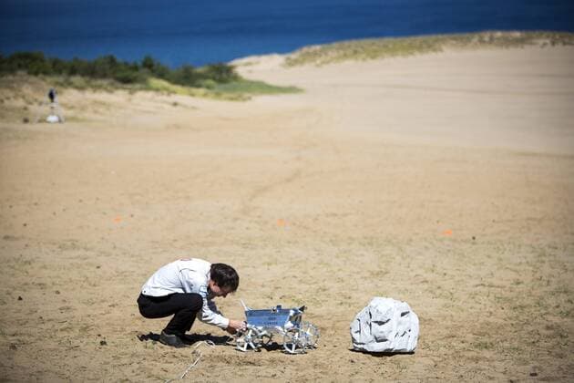 September 27, 2016 - Tottori, Tottori Prefecture, Japan - Hakuto s rover PFM3 pre-flight model is seen being tested by team ispace, Tohoku University researchers and students in Tottori Sand Dunes, Tottori Prefecture, Japan on September 27, 2016. Mounted on AstroboticÃ¢â‚¬â„¢s Ã¢â‚¬Å PeregrineÃ¢â‚¬Â lander, HAKUTOÃ¢â‚¬â„¢s rover will be launched from the Earth by SpaceXÃ¢â‚¬â„¢s Falcon 9 rocket, and sent to lunar orbit. The Peregrine lander will achieve soft landing on the moon. The rover is then deployed onto the MoonÃ¢â‚¬â„¢s surface..(Photo by Richard Atrero de Guzman NURPhoto) Tottori Japan  - ZUMAn230