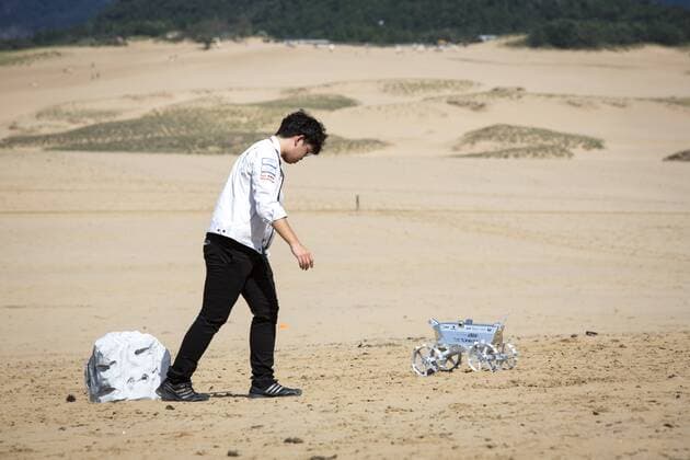 September 27, 2016 - Tottori, Tottori Prefecture, Japan - Hakuto s rover PFM3 pre-flight model is seen being tested by team ispace, Tohoku University researchers and students in Tottori Sand Dunes, Tottori Prefecture, Japan on September 27, 2016. Mounted on AstroboticÃ¢â‚¬â„¢s Ã¢â‚¬Å PeregrineÃ¢â‚¬Â lander, HAKUTOÃ¢â‚¬â„¢s rover will be launched from the Earth by SpaceXÃ¢â‚¬â„¢s Falcon 9 rocket, and sent to lunar orbit. The Peregrine lander will achieve soft landing on the moon. The rover is then deployed onto the MoonÃ¢â‚¬â„¢s surface..(Photo by Richard Atrero de Guzman NURPhoto) Tottori Japan  - ZUMAn230