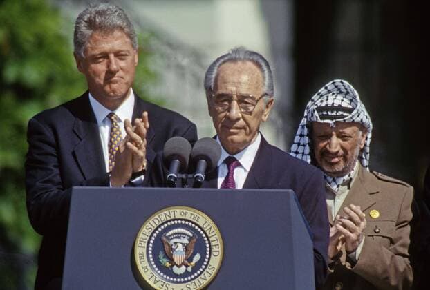 SHIMON PERES (2 August 1923 - 28 September 2016) was a Polish-born Israeli statesman. Born Szymon Perski, he was the ninth President of Israel from 2007 to 2014, served twice as the Prime Minister of Israel and twice as Interim Prime Minister, and he was a member of 12 cabinets in a political career spanning over 66 years. Peres won the 1994 Nobel Peace Prize together with Yitzhak Rabin and Yasser Arafat for the peace talks that he participated in as Israeli Foreign Minister, producing the Oslo Accords. PICTURED: Sept 13, 1993 - Washington, District of Columbia, U.S. - Israeli Foreign Minister SHIMON PERES, center, speaks as President BILL CLINTON and PLO chairman YASSER ARAFAT applaud during the signing of the Olso Accords at the White House. Washington U.S.  - ZUMA