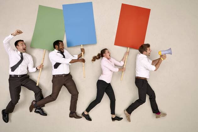 Four business colleagues demonstrating model released Symbolfoto  BAEF001217