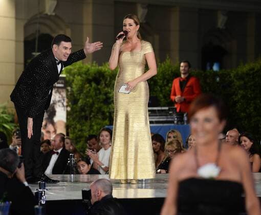 Beauty queen and actress Alicia Machado announces winners with Eduardo Khawam during the Metropolitan Fashion Week Closing Gala & Awards Show at Warner Bros Studios in Burbank, California on October 1, 2016. The former Miss Universe, whom Democratic presidential candidate Hillary Clinton mentioned during the first presidential debate, has been the subject of series of derisive tweets from Clinton s Republican opponent Donald Trump.  LAP2016100120 JIMxRUYMEN