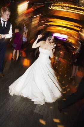 A bride dancing at her wedding party. A bride dancing at her wedding party.  24084