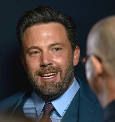Ben Affleck (L) speaks with director Gavin O Connor as they arrive at the world premiere of The Accountant at the TCL Chinese Theater in Los Angeles, California on October 10, 2016.  LAP20161010751 CHRISTINExCHEW