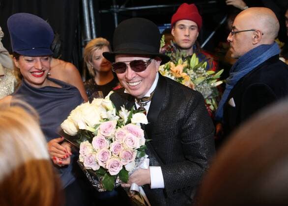 MOSCOW, RUSSIA â€“ OCTOBER 13, 2016: Designer Slava Zaitsev (C) receives flowers after a runway show at the Mercedes-Benz Fashion Week Russia in the Manege Central Exhibition Hall. Vyacheslav Prokofyev TASS  TS034689