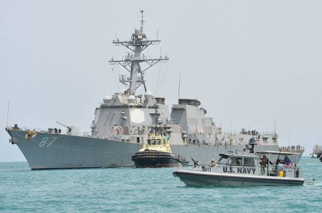 July 23, 2016 - At sea - The US Navy Arleigh Burke-class guided-missile destroyer USS Mason pulls into port escorted by Coastal Riverine Squadron 8 sea ark patrol boats July 23, 2016 in the Port of Djibouti. The USS Mason was fired upon by Houthi rebels while sailing off the coast of Yemen in the southern end of the Red Sea on October 12, 2016 and the USS Nitze returned missile fire destroying ground stations in Yemen. At sea - ZUMAp138