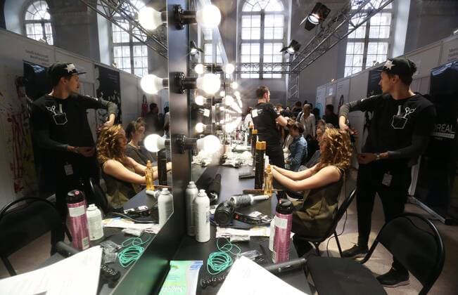 MOSCOW, RUSSIA - OCTOBER 16, 2016: Models have their hair done ahead of a runway show for the Spring Summer 2017 collection by Russian fashion designer Yegor Zaitsev at the Mercedes-Benz Fashion Week Russia in the Manege Central Exhibition Hall. Vyacheslav Prokofyev TASS  TS034B0A
