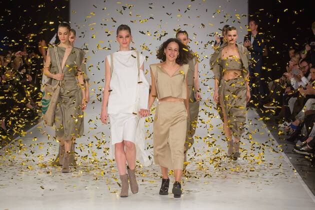 Hungarian fashion designer Alma Vetlenyi (R front) celebrates her award with models during the Gombold ujra Central Europe fashion design competition in Budapest, Hungary, on Oct. 16, 2016. Alma Vetlenyi won the Design Terminal Award. The competition was held by Hungary s Design Terminal. )(zcc) HUNGARY-BUDAPEST-FASHION-COMPETITION AttilaxVolgyi 