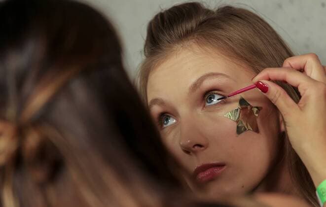 October 15, 2016 - Budapest, Hungary - A model gets makeup applied backstage before Tomcsanyi fashion show at Mercedes-Benz Fashion Week Central Europe on Oct 15, 2016 at VoÂ¡rkert BazoÂ¡r in Budapest, Hungary. Budapest Hungary  - ZUMAn230