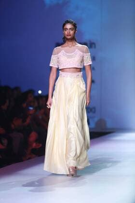 NEW DELHI, INDIA - OCTOBER 15: A model showcases the creation of designer Mandira Wirk during Amazon India Fashion Week Spring-Summer 17 at NSIC Exhibition Complex on October 15, 2016 in New Delhi, India. (Photo by Amal Ks Hindustan Times) Amazon India Fashion Week Spring Summer 2017