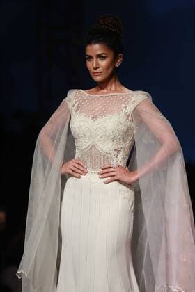 NEW DELHI, INDIA - OCTOBER 15: A model showcases the creation of designer Mandira Wirk during Amazon India Fashion Week Spring-Summer 17 at NSIC Exhibition Complex on October 15, 2016 in New Delhi, India. (Photo by Amal Ks Hindustan Times) Amazon India Fashion Week Spring Summer 2017