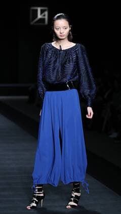October 17, 2016, Tokyo, Japan - A model displays a creation of Japanese designer Tae Ashida at her spring and summer collection in Tokyo as a part of Japan Fashion Week on Monday, October 17, 2016. Tae Ashida celebrated her 25th anniversary collection.  (lwxa005446)