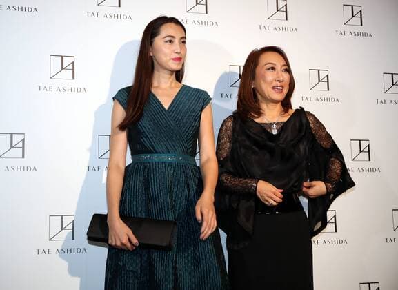October 17, 2016, Tokyo, Japan - Japanese actress Miki Arimura (L) smiles with Japanese designer Tae Ashida at her spring and summer collection in Tokyo as a part of Japan Fashion Week on Monday, October 17, 2016. Tae Ashida celebrated her 25th anniversary collection.  (lwxa005463)