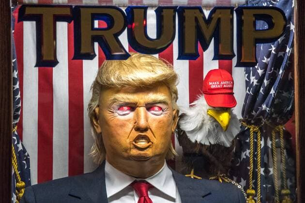 A fortune-telling fairground attraction representing Republican presidential candidate Donald Trump appears outside a New York theater screening the premiere of the documentary Michael Moore In TrumpLand on October 18, 2016. Filmmaker Michael Moore had finished editing the film the previous day and made a surprise last-minute announcement on Twitter that he would show it for free today. The film will play for a week in Los Angeles and New York starting tomorrow. Photo by Enrique Shore Cordon Press  ENRIQUExSHORE A robot of Trump sits outside the premiere of documentary MIcha