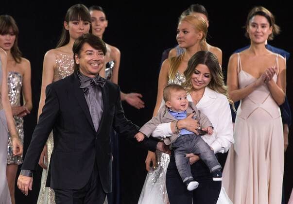 MOSCOW, RUSSIA - OCTOBER 18, 2016: Designer Valentin Yudashkin with daughter Galina and grandson Anatoly (L-R front) acknowledges the audience after a runway show for his Spring Summer 2017 collection at the 2016 Moscow Fashion Week, in Moscow s Gostiny Dvor Shopping and Exhibition Centre. Dmitry Serebryakov TASS  TS034DA0