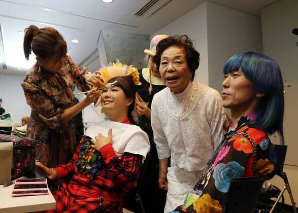 October 19, 2016, Tokyo, Japan - Former leprosy patient Miyo Maki (2nd R) smiles with designer Takafumi Tsuruta (R) and transgender actress Ai Haruna as they prepare for the tenbo 2017 spring summer collection as a part of Japan Fashion Week in Tokyo on Wednesday, October 19, 2016.  (lwxa005582)