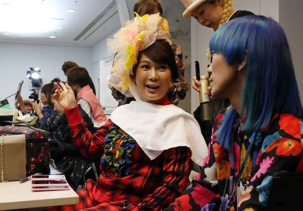October 19, 2016, Tokyo, Japan - Japanese transgender actress Ai Haruna (L) chats with designer Takafumi Tsuruta as they prepare for the tenbo 2017 spring summer collection as a part of Japan Fashion Week in Tokyo on Wednesday, October 19, 2016.  (lwxa005585)