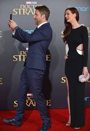 Chris Hardwick takes a selfie of his wife Lydia Hearst and himself on the red carpet as they arrive at the world premiere of Marvel Studios Doctor Strange at the El Capitan Theatre in Los Angeles, California on October 20, 2016.  LAP20161020621 CHRISTINExCHEW