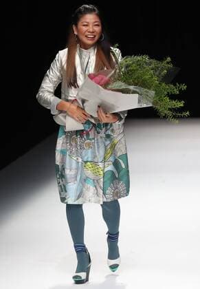 October 21, 2016, Tokyo, Japan - Japanese designer Yuma Koshino receives a flower bouquet at her 2017 spring summer collection in Tokyo as a part of Japan Fashion Week on Friday, October 21, 2016.  (lwxa005642)