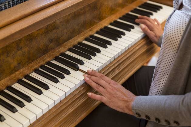 Hands of woman playing piano, close-up model released Symbolfoto property released  JUNF00678