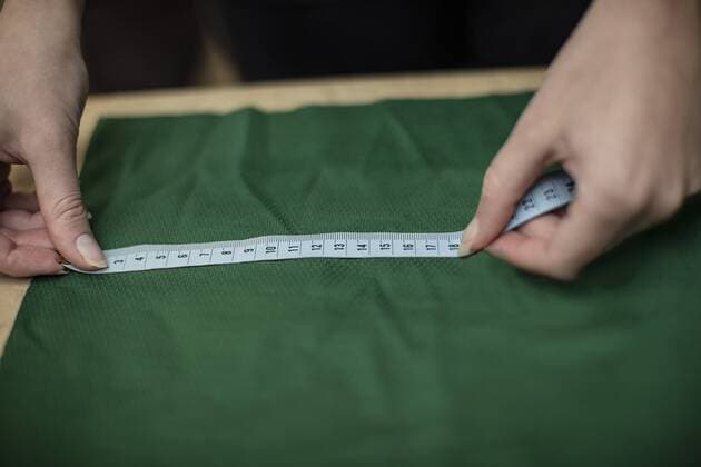 Close-up of woman working with measuring tape in tailor shop model released Symbolfoto property released  ZEF10683