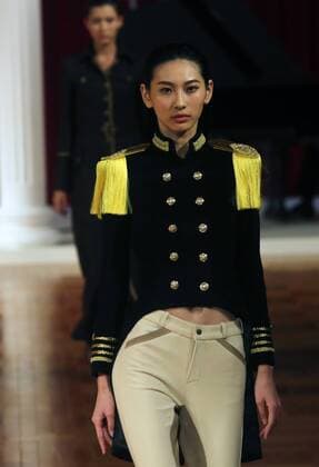 Chinese models wear clothing from the NE Tiger 2017 collection during China s international fashion week in Beijing on October 25, 2016. Chinese fashion designers are becoming an international force with both European and American fashion houses looking at the new, fresh Chinese clothing-minds as potential partners in future clothing brands.  PEK2016102502 STEPHENxSHAVER