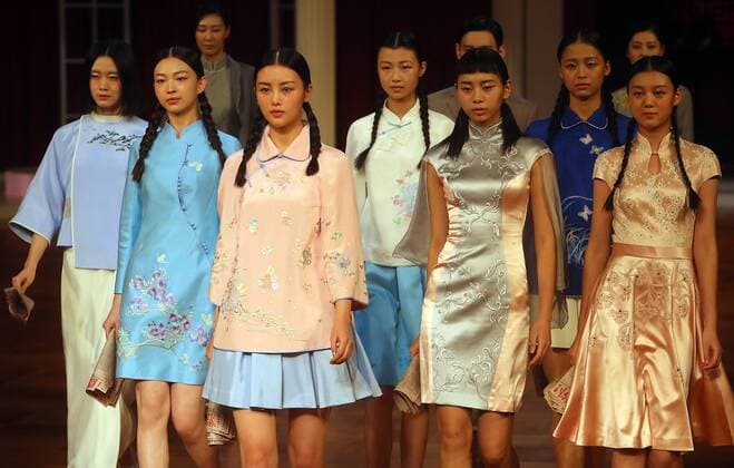 Chinese models wear clothing from the NE Tiger 2017 collection during China s international fashion week in Beijing on October 25, 2016. Chinese fashion designers are becoming an international force with both European and American fashion houses looking at the new, fresh Chinese clothing-minds as potential partners in future clothing brands.  PEK2016102508 STEPHENxSHAVER