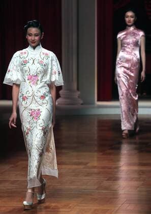 Chinese models wear clothing from the NE Tiger 2017 collection during China s international fashion week in Beijing on October 25, 2016. Chinese fashion designers are becoming an international force with both European and American fashion houses looking at the new, fresh Chinese clothing-minds as potential partners in future clothing brands.  PEK2016102509 STEPHENxSHAVER