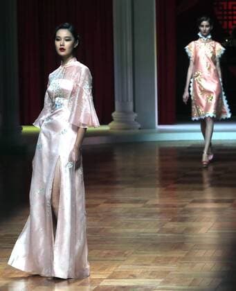 Chinese models wear clothing from the NE Tiger 2017 collection during China s international fashion week in Beijing on October 25, 2016. Chinese fashion designers are becoming an international force with both European and American fashion houses looking at the new, fresh Chinese clothing-minds as potential partners in future clothing brands.  PEK2016102511 STEPHENxSHAVER