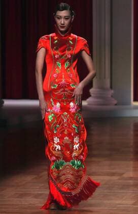 Chinese models wear clothing from the NE Tiger 2017 collection during China s international fashion week in Beijing on October 25, 2016. Chinese fashion designers are becoming an international force with both European and American fashion houses looking at the new, fresh Chinese clothing-minds as potential partners in future clothing brands.  PEK2016102512 STEPHENxSHAVER