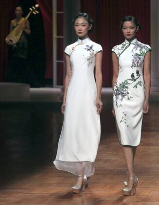Chinese models wear clothing from the NE Tiger 2017 collection during China s international fashion week in Beijing on October 25, 2016. Chinese fashion designers are becoming an international force with both European and American fashion houses looking at the new, fresh Chinese clothing-minds as potential partners in future clothing brands.  PEK2016102515 STEPHENxSHAVER