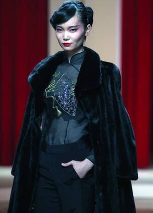 Chinese models wear clothing from the NE Tiger 2017 collection during China s international fashion week in Beijing on October 25, 2016. Chinese fashion designers are becoming an international force with both European and American fashion houses looking at the new, fresh Chinese clothing-minds as potential partners in future clothing brands.  PEK2016102517 STEPHENxSHAVER
