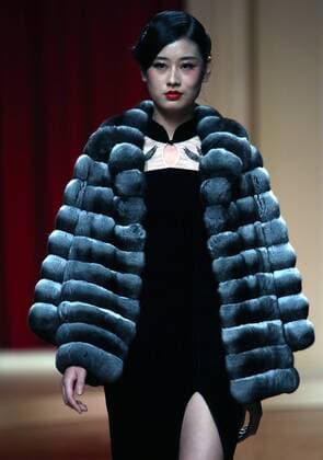Chinese models wear clothing from the NE Tiger 2017 collection during China s international fashion week in Beijing on October 25, 2016. Chinese fashion designers are becoming an international force with both European and American fashion houses looking at the new, fresh Chinese clothing-minds as potential partners in future clothing brands.  PEK2016102518 STEPHENxSHAVER
