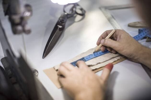 Tailor measuring cloth in designer factory model released Symbolfoto property released  ZEF10520