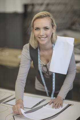 Young woman working on template in tailor shop model released Symbolfoto property released  ZEF10680