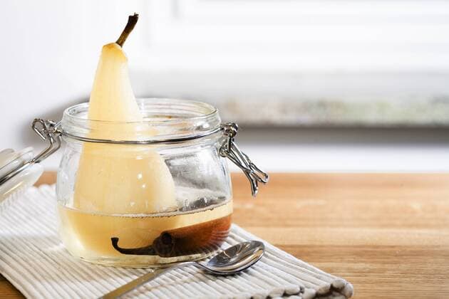 Stockholm, Sweden - High angle view of a pear poaching in a jar.  Copyright: xIntixSt.xClairx xDanitaxDelimont EU28 IST0043