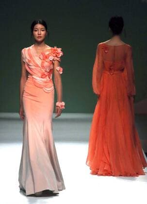 Chinese models wear clothing from the Chuyun 2017 collection during China s international fashion week in Beijing on October 28, 2016. Chinese fashion designers are becoming an international force with both European and American fashion houses looking at the new, fresh Chinese clothing-minds as potential partners in future clothing brands.  PEK2016102803 STEPHENxSHAVER