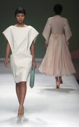 Chinese models wear clothing from the Chuyun 2017 collection during China s international fashion week in Beijing on October 28, 2016. Chinese fashion designers are becoming an international force with both European and American fashion houses looking at the new, fresh Chinese clothing-minds as potential partners in future clothing brands.  PEK2016102806 STEPHENxSHAVER