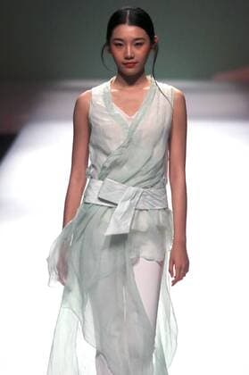 Chinese models wear clothing from the Chuyun 2017 collection during China s international fashion week in Beijing on October 28, 2016. Chinese fashion designers are becoming an international force with both European and American fashion houses looking at the new, fresh Chinese clothing-minds as potential partners in future clothing brands.  PEK2016102809 STEPHENxSHAVER