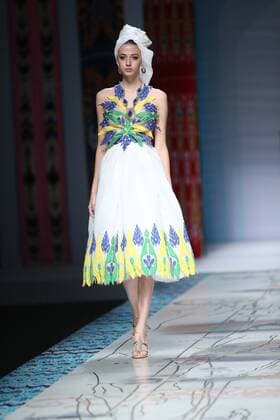 October 27, 2016 - Beijing, Beijing, China - Beijing,CHINA-October 27 2016: (EDITORIAL USE ONLY. CHINA OUT) ..A model presents a creation designed by designer Tao Tao at China Fashion Week in Beijing, October 27th, 2016.The fashion show is themed with Loulan Kingdom, which was an ancient kingdom based around an important oasis city along the Silk Road on the northeastern edge of the Lop Desert in China. Beijing China  - ZUMAs145 20161027_zaa_s145_211
