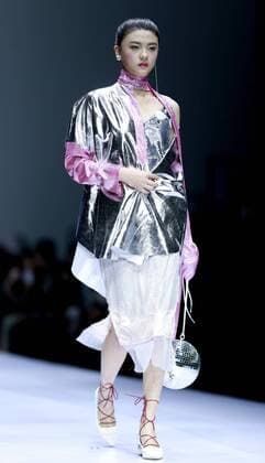 A model presents a creation at the HIKARI Cup 2016 China 3D Digital Fashion Design Contest during the China Fashion Week in Beijing, capital of China, Oct. 28, 2016. ) (ry) CHINA-BEIJING-FASHION WEEK (CN) ChenxJianli 